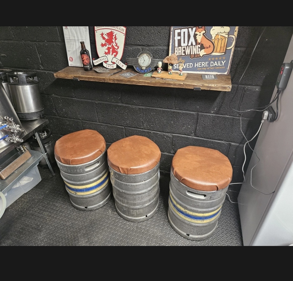 Tan leather keg stools in bar